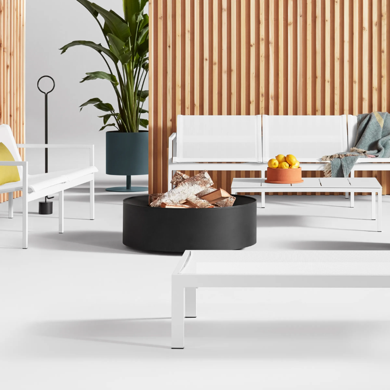 The Pokey von Pokerson Fire Poker from Blu Dot in a family room.