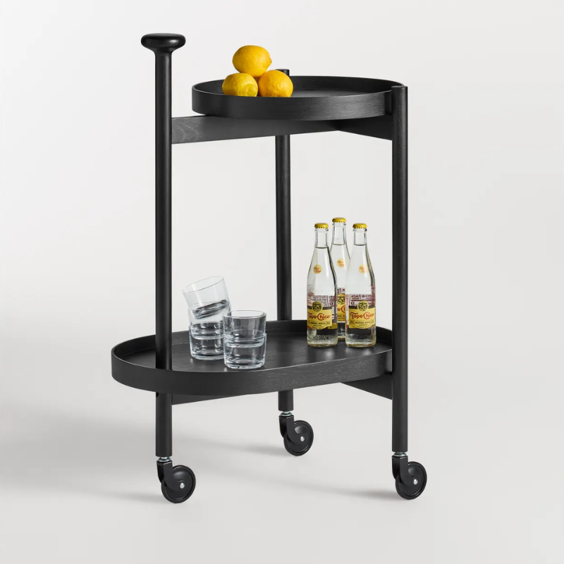 The Pose Bar Cart from Blu Dot in black on ash in a living space.
