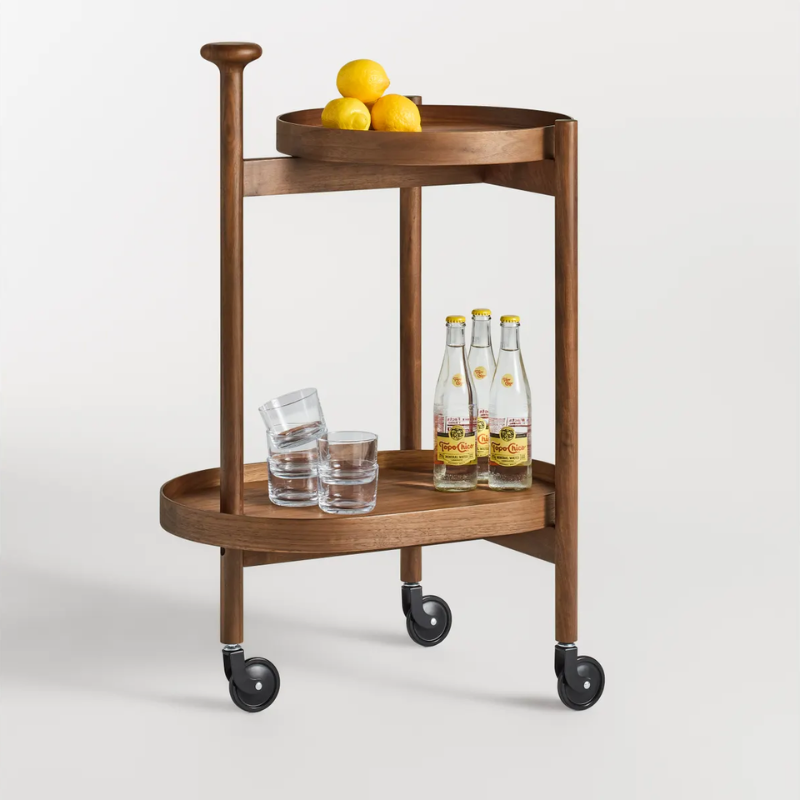 The Pose Bar Cart from Blu Dot in walnut in a family room.