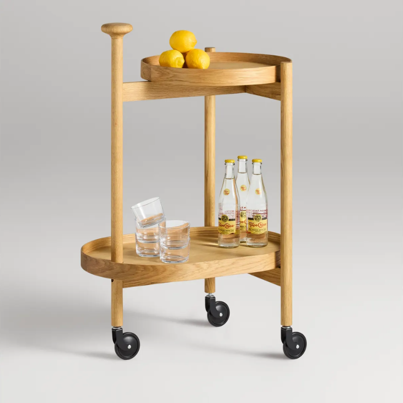 The Pose Bar Cart from Blu Dot in white oak in a lounge.