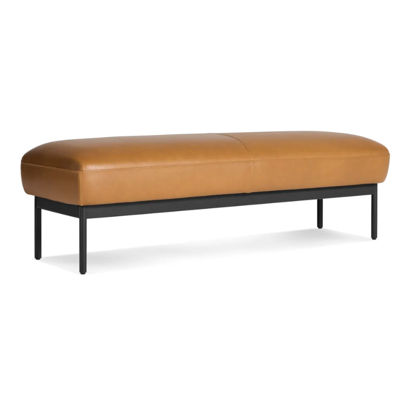 The Puff Puff Bench from Blu Dot with canyon leather upholstery from an angle.