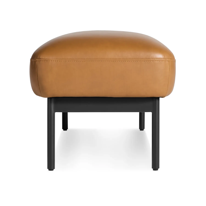 The Puff Puff Bench from Blu Dot with canyon leather upholstery from the side.