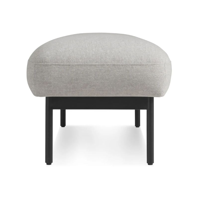 The Puff Puff Bench from Blu Dot with edwards light grey fabric upholstery from the side.