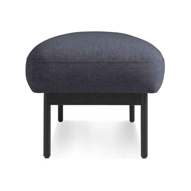 The Puff Puff Bench from Blu Dot with edwards navy fabric upholstery from the side.