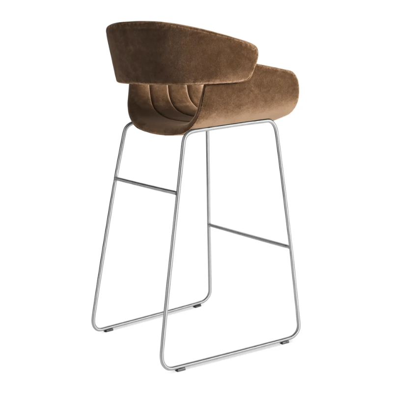 The Racer Bar Stool from Blu Dot with Coffee Velvet upholstery from the back at an angle.