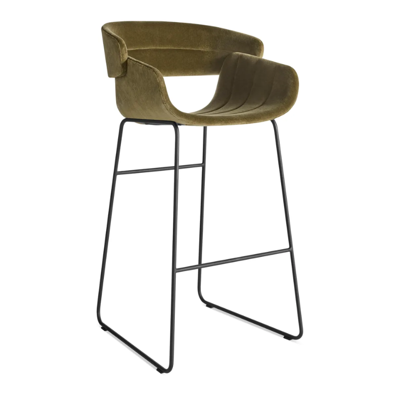 The Racer Bar Stool from Blu Dot with Moss Velvet upholstery from an angle.