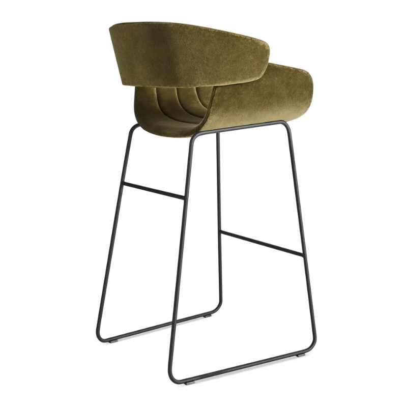 The Racer Bar Stool from Blu Dot with Moss Velvet upholstery from the back at an angle.