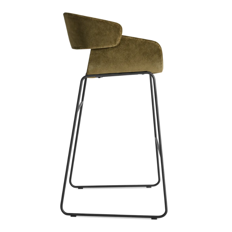 The Racer Bar Stool from Blu Dot with Moss Velvet upholstery from the side.