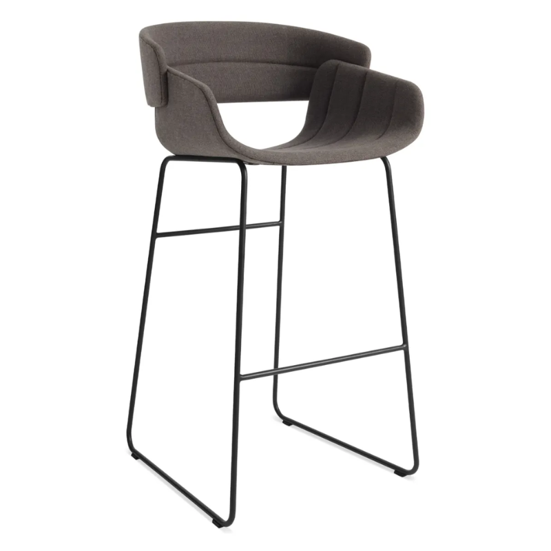 The Racer Bar Stool from Blu Dot with Toohey Charcoal upholstery from an angle.