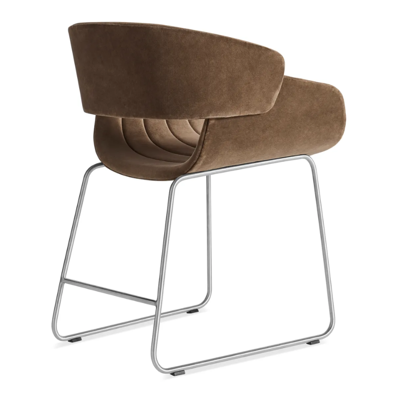 The Racer Chair from Blu Dot with Coffee Velvet upholstery from the back at an angle.