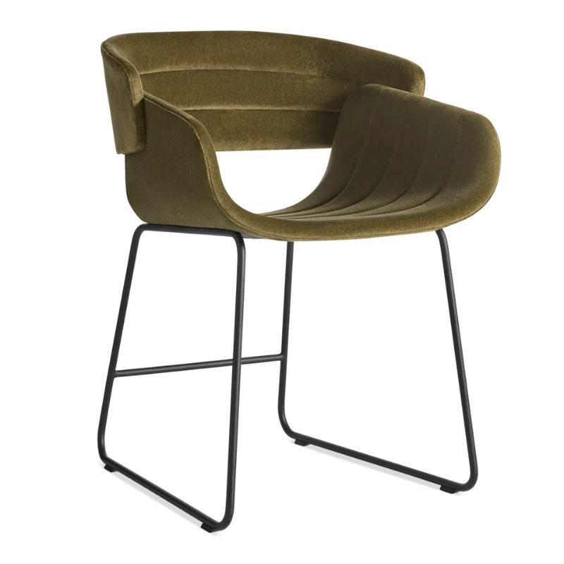 The Racer Chair from Blu Dot with Moss Velvet upholstery from an angle.