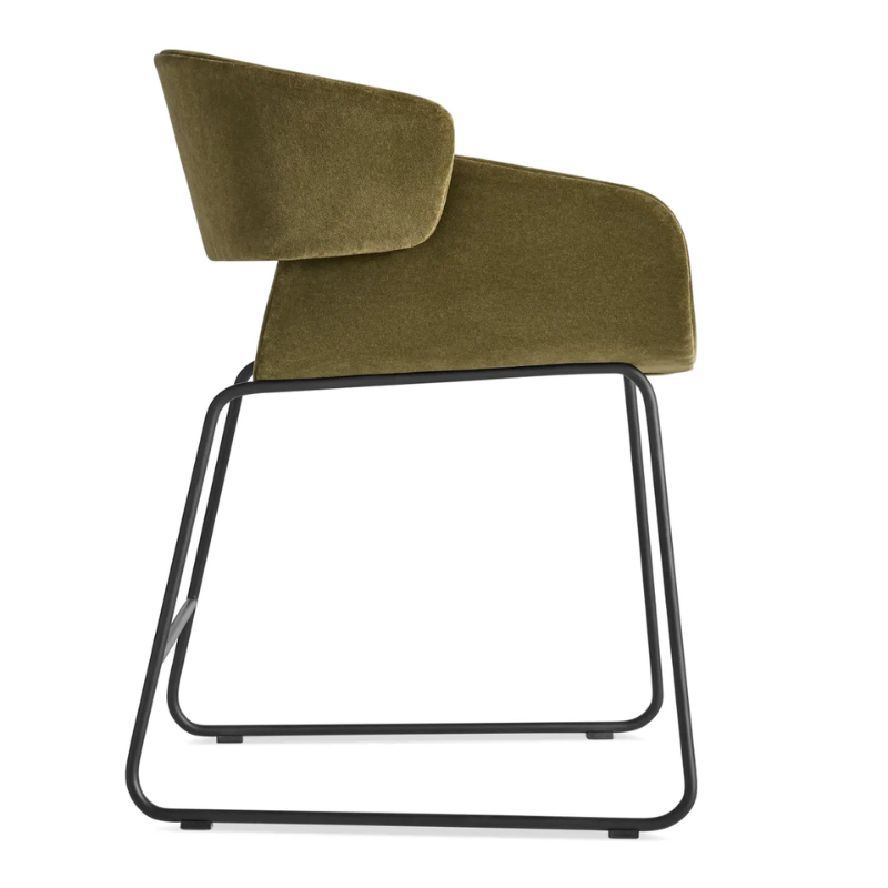 The Racer Chair from Blu Dot with Moss Velvet upholstery from the side.