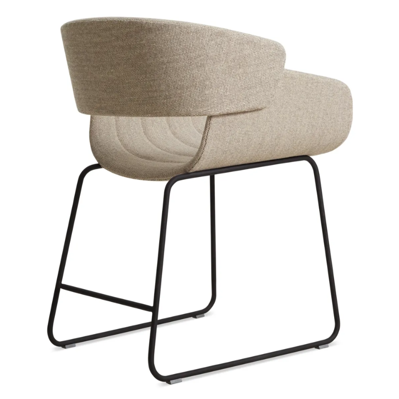 The Racer Chair from Blu Dot with Tait Stone upholstery from the back at an angle.