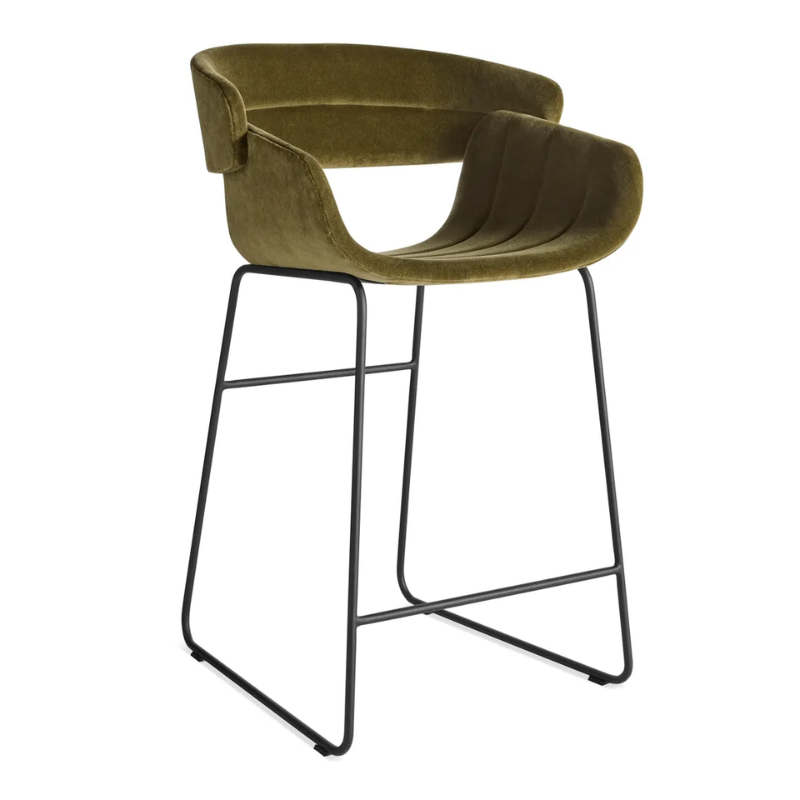 The Racer Counter Stool from Blu Dot in Moss Velvet upholstery from an angle.
