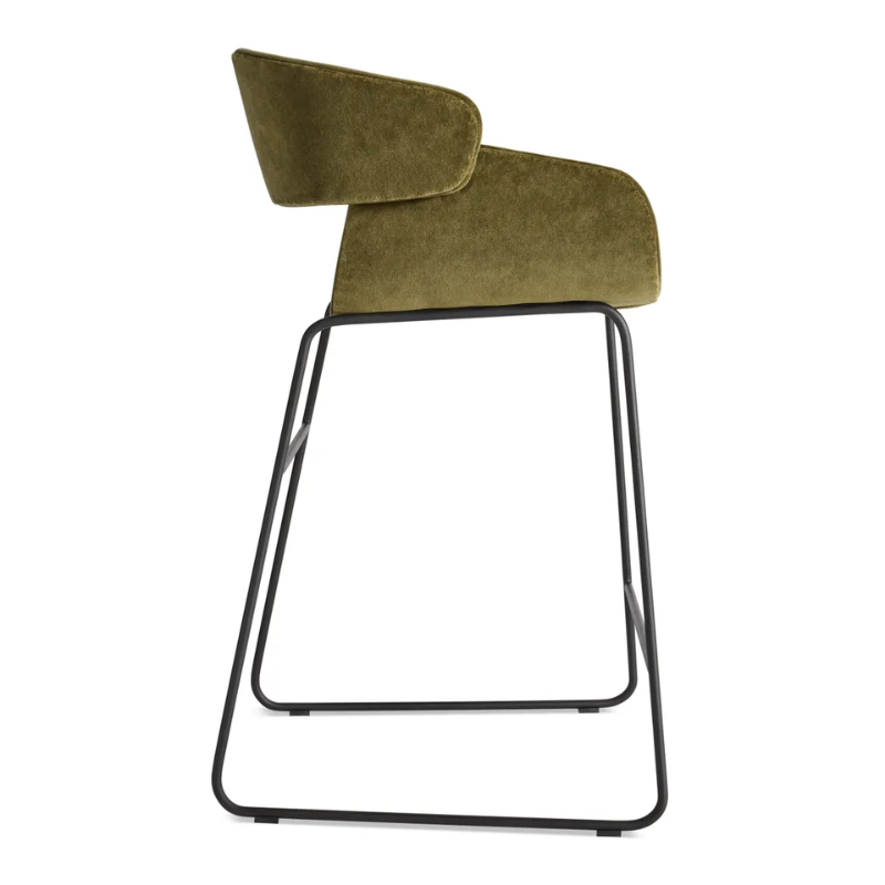 The Racer Counter Stool from Blu Dot in Moss Velvet upholstery from the side.