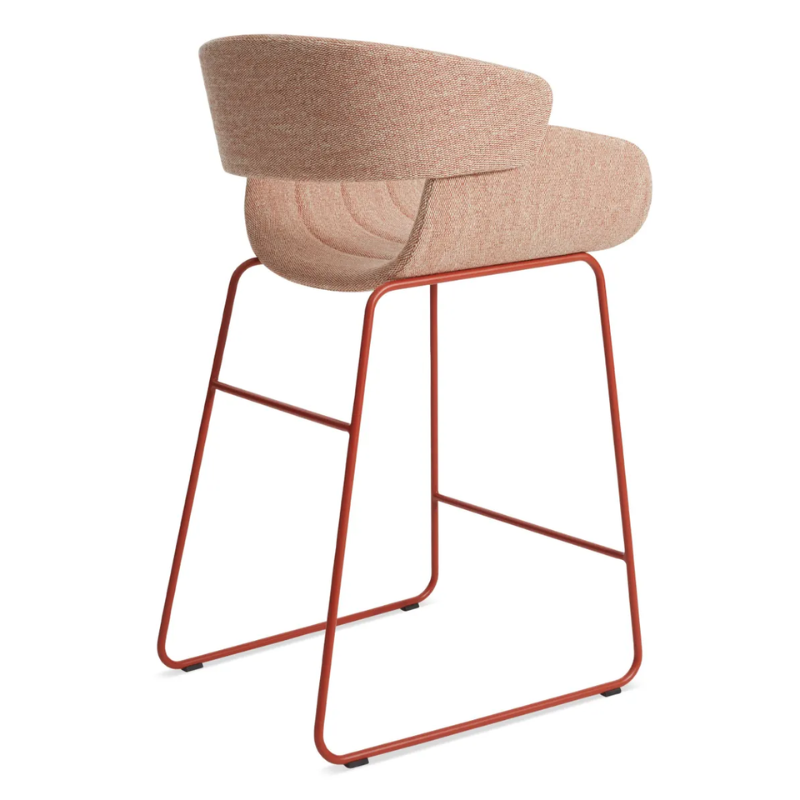 The Racer Counter Stool from Blu Dot in Tait Tomato upholstery from the back at an angle.