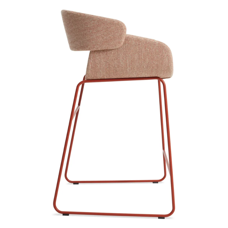 The Racer Counter Stool from Blu Dot in Tait Tomato upholstery from the side.