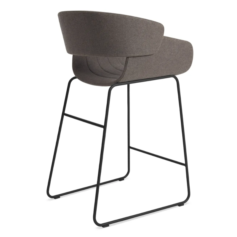 The Racer Counter Stool from Blu Dot in Toohey Charcoal upholstery from the back at an angle.