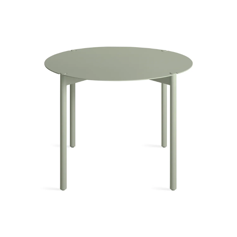 The Round Comeuppance Dining Table from Blu Dot in grey green from a high angle.