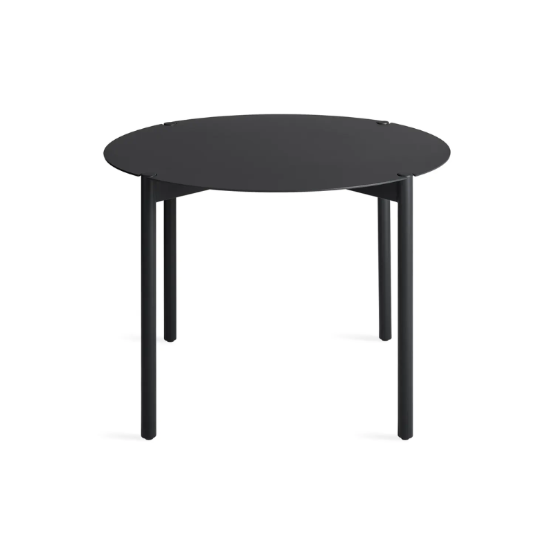 The Round Comeuppance Dining Table from Blu Dot in oblivion from a high angle.