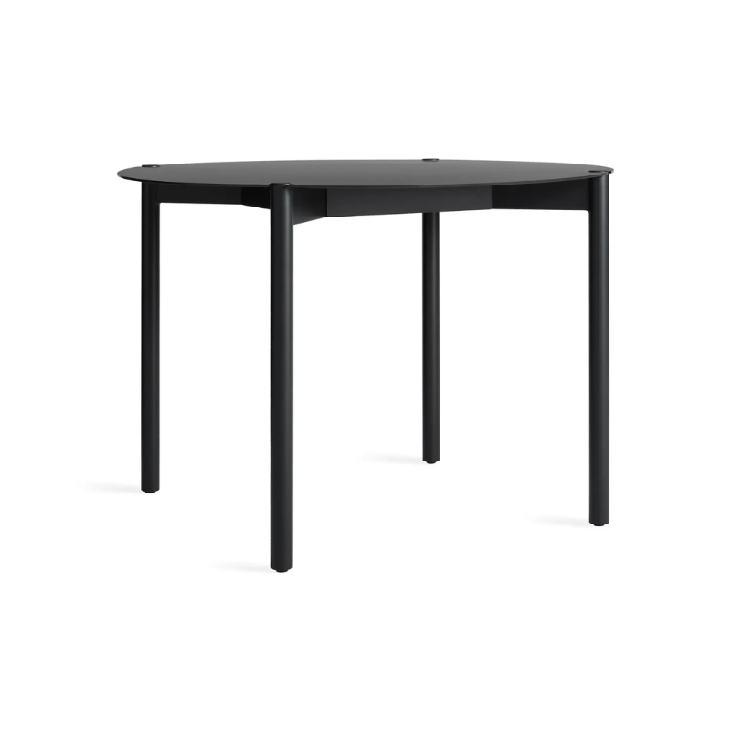 The Round Comeuppance Dining Table from Blu Dot in oblivion from the side.