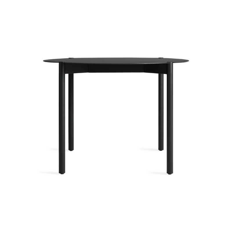 The Round Comeuppance Dining Table from Blu Dot in oblivion.