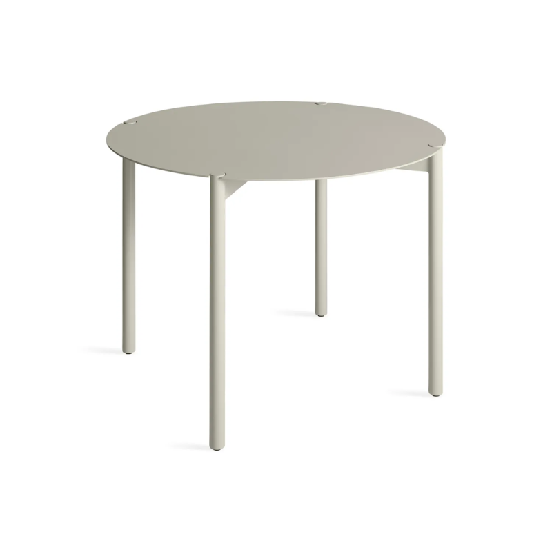 The Round Comeuppance Dining Table from Blu Dot in putty from an angle.