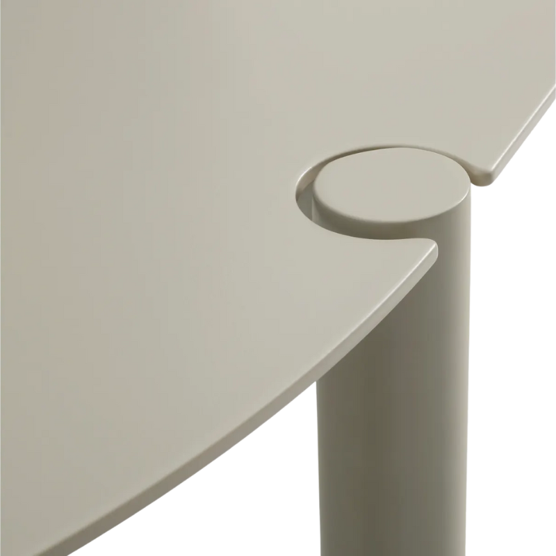 The Round Comeuppance Dining Table from Blu Dot in putty close up.