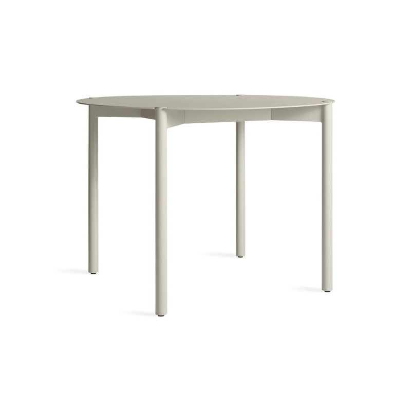 The Round Comeuppance Dining Table from Blu Dot in putty from the side.