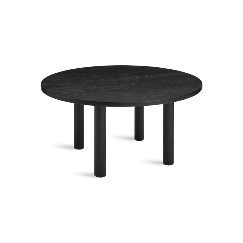 The Round Good Times Dining Table from Blu Dot in black on ash from an angle.