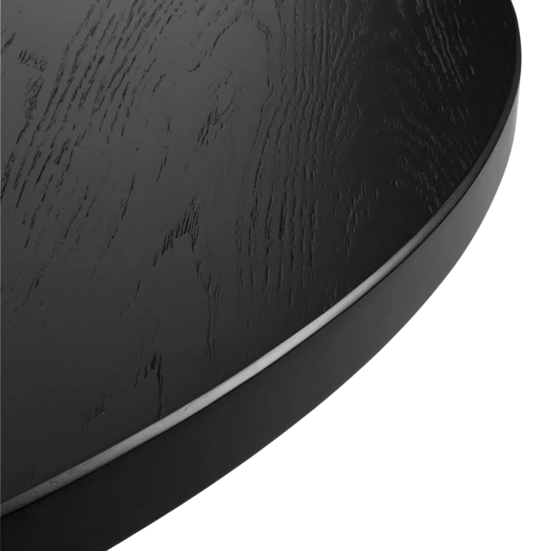 The Round Good Times Dining Table from Blu Dot in black on ash close up.