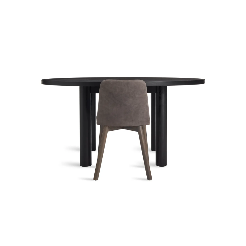 The Round Good Times Dining Table from Blu Dot in black on ash in an office.