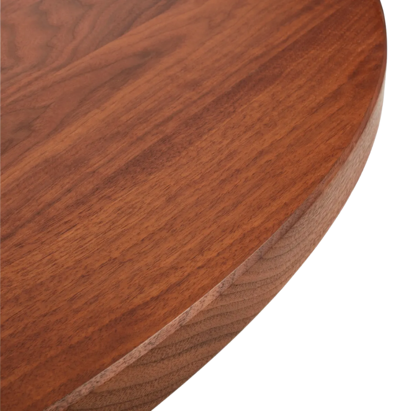 The Round Good Times Dining Table from Blu Dot in walnut in detail.