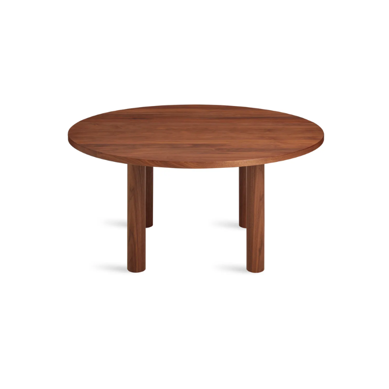 The Round Good Times Dining Table from Blu Dot in walnut from a high angle.