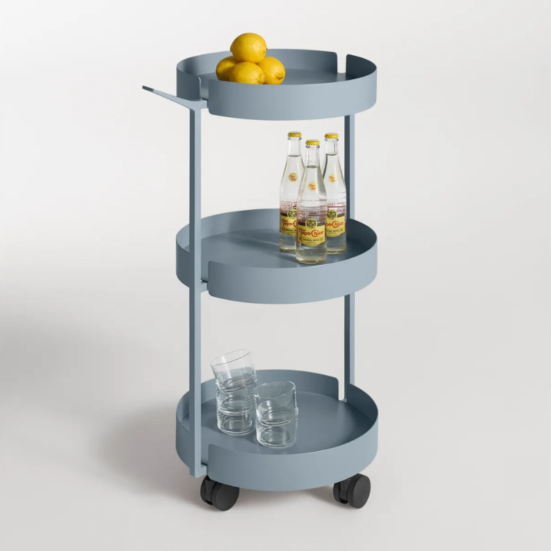 The Scoots McGee Cart from Blu Dot in grey blue in a living room.