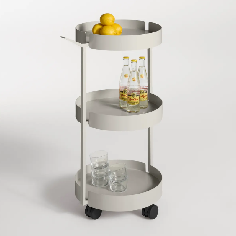 The Scoots McGee Cart from Blu Dot in putty in a family room.