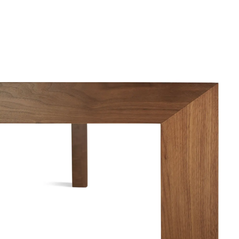 The 95 inch Second Best Wood Dining Table from Blu Dot focusing on the design.