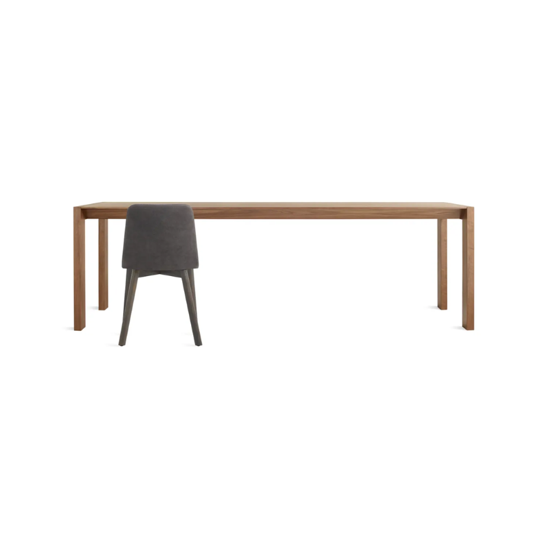 The 95 inch Second Best Wood Dining Table from Blu Dot in a studio.