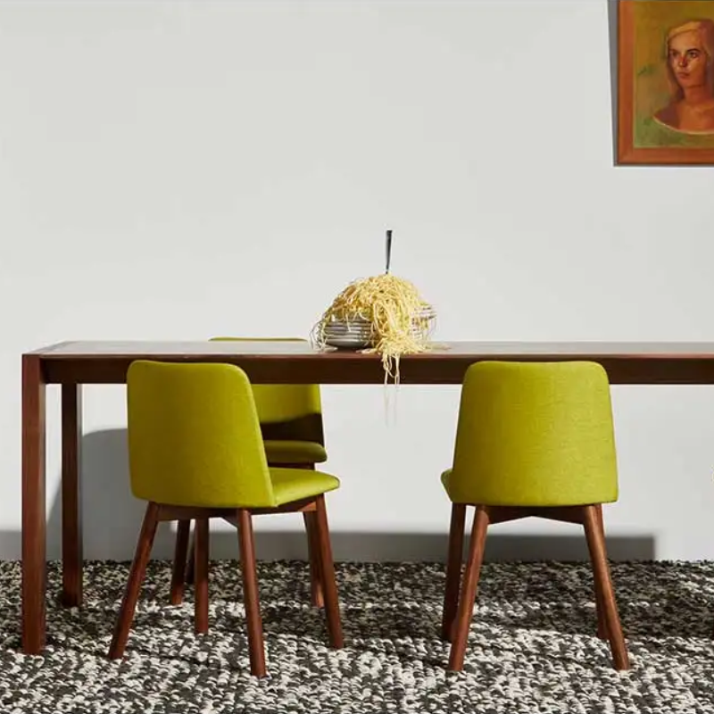The 95 inch Second Best Wood Dining Table from Blu Dot in a dining room.