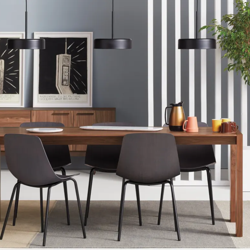 The 76 inch Second Best Wood Dining Table from Blu Dot in a family room.
