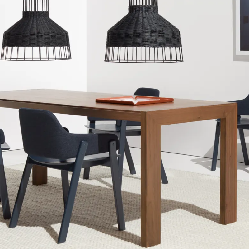 The 76 inch Second Best Wood Dining Table from Blu Dot in a living room.