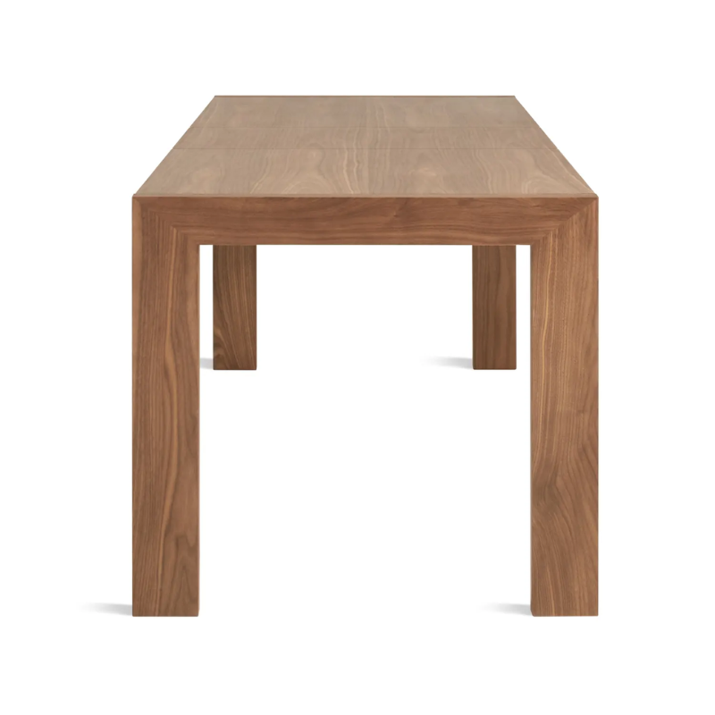 The Second Best Wood Extendable Dining Table from Blu Dot from the side at an angle.