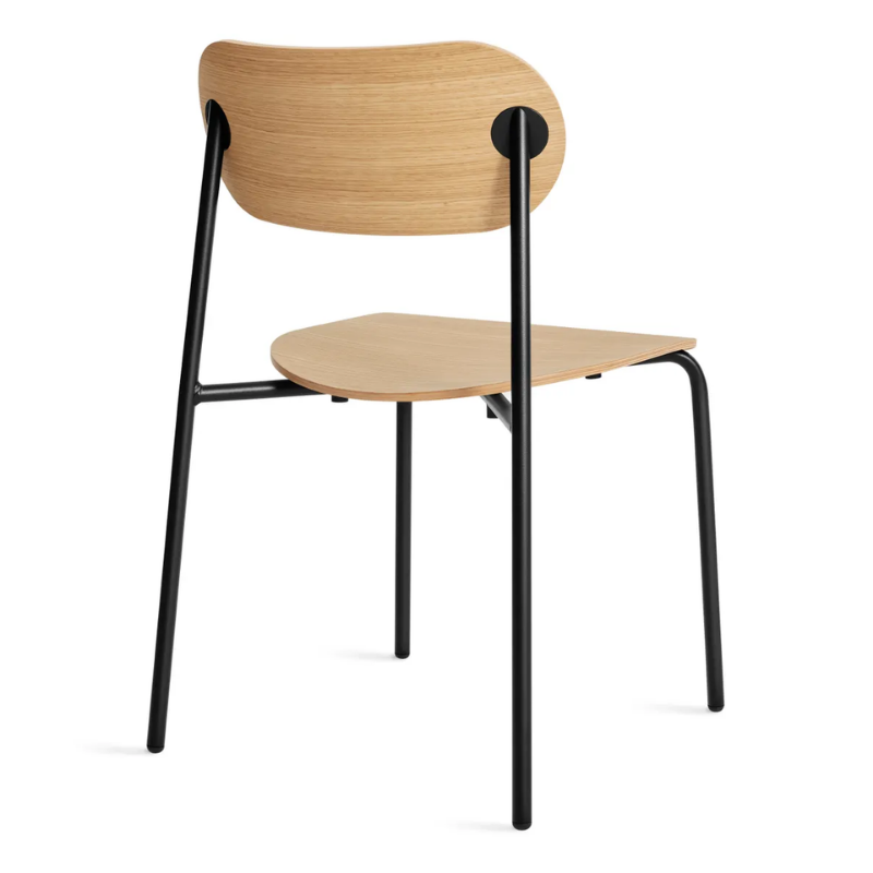 The SideBySide Chair from Blu Dot in white oak from the back at an angle.