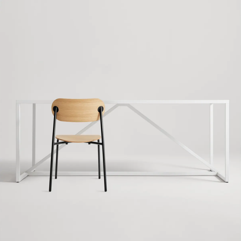 The SideBySide Chair from Blu Dot in white oak in a studio.