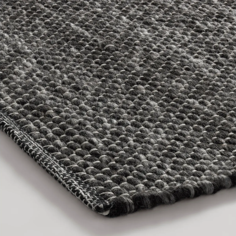 The Sinder Rug from Blu Dot in Charcoal handwoven wool close up.