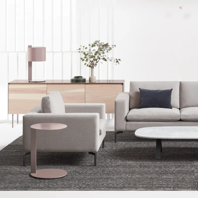 The Sinder Rug from Blu Dot in Charcoal handwoven wool in a living room.