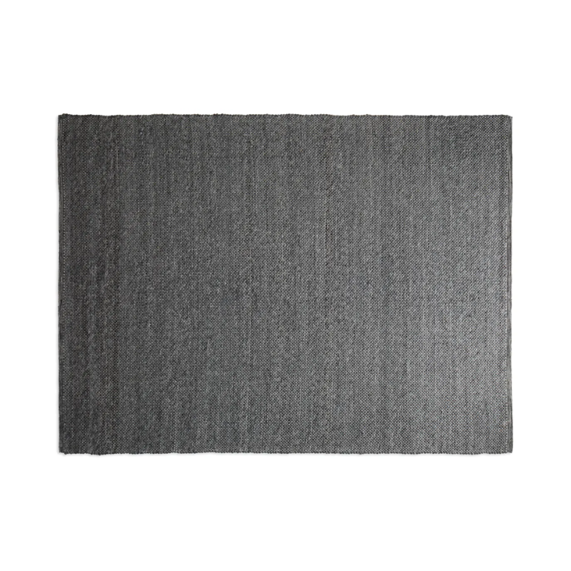 The five by eight foot Sinder Rug from Blu Dot in Charcoal handwoven wool.