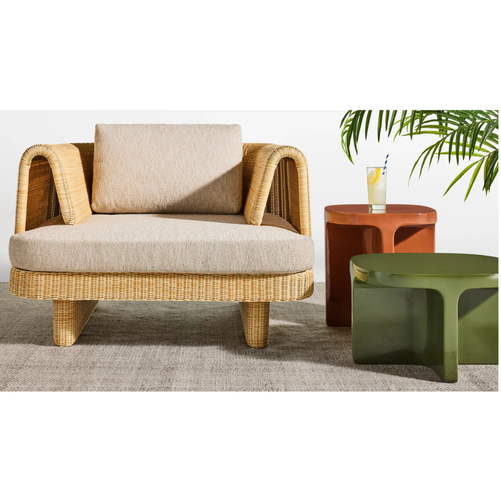 The olive and rust Small Talk Tall Side Table from bludot with a Loophole outdoor lounge chair. all-groups