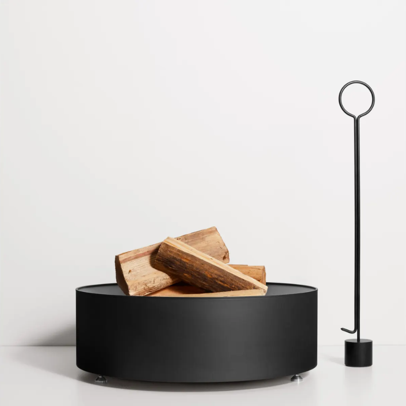 The Smokey Fire Pit from Blu Dot in a studio.