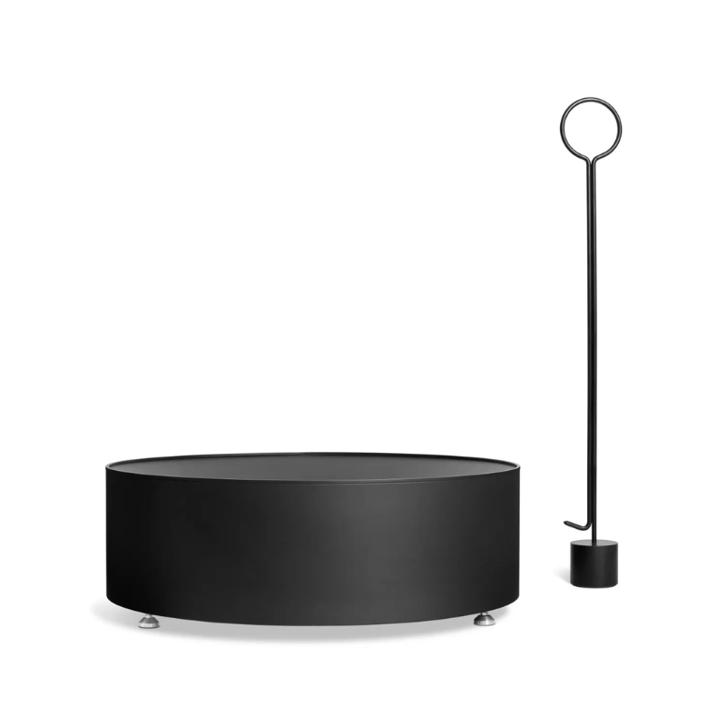 The Smokey Fire Pit from Blu Dot with a fire poker.